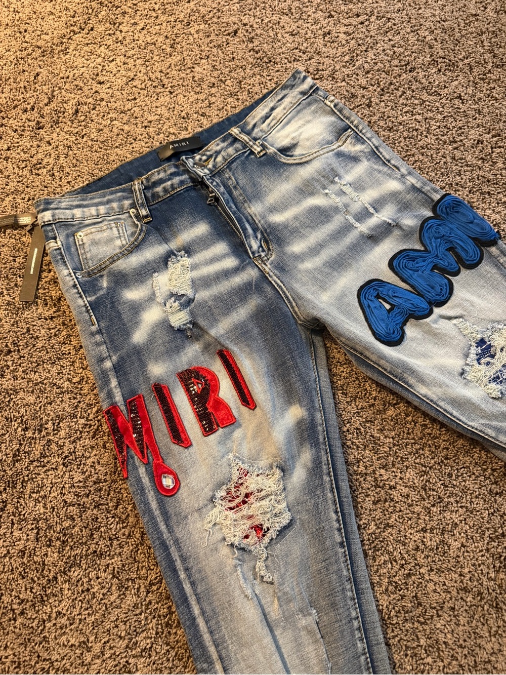 AMIRI Blue Distressed Jeans with Red & Blue Patches